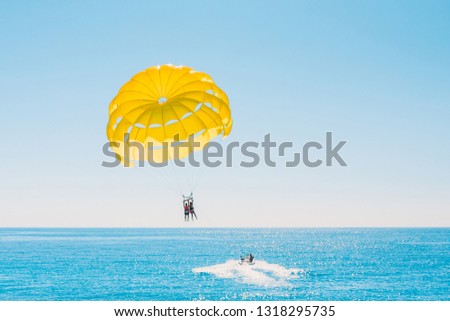 Delight of people from parasailing flight - incredible impressions of the freedom of soaring and amazing view from the height Royalty-Free Stock Photo #1318295735