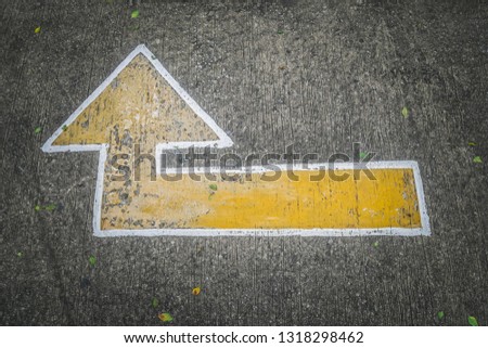 Old Arrow sign on road floor or parking