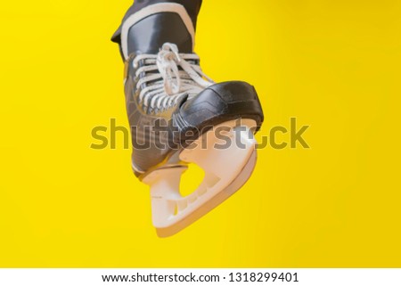 men wear skates isolated on yellow background