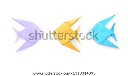 Origami fish on white background