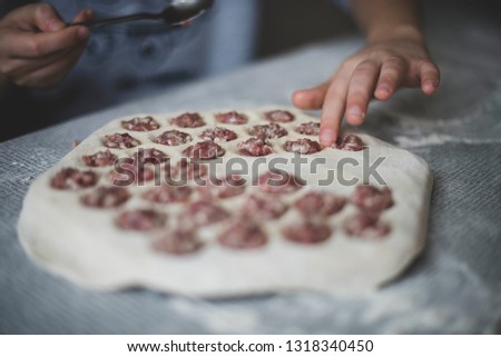 cooking a dough. hands in flour. food on the table Royalty-Free Stock Photo #1318340450