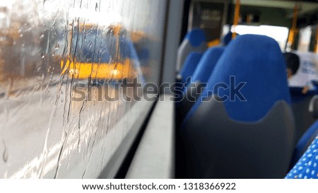 Sitting in the bus while raining outside in the city