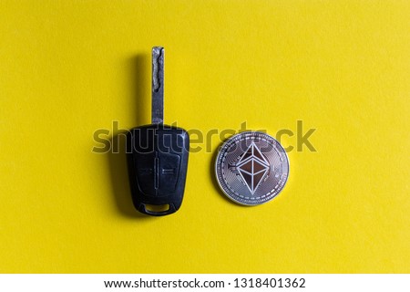 Ethereum Cryptocurrency Bitcoin Coin Car Key isolated yellow colourful background, crypto used to buy car, private key