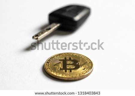Cryptocurrency Bitcoin Coin Car Key isolated white background, crypto used to buy car, private key, selective focus