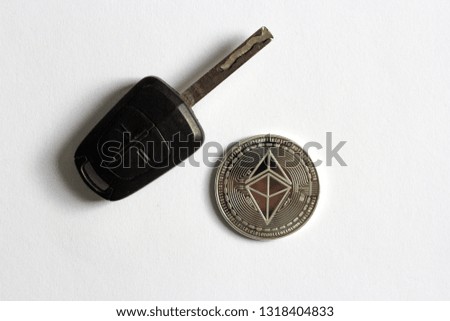 Ethereum Cryptocurrency Bitcoin Coin Car Key isolated white background, crypto used to buy car, private key, selective focus