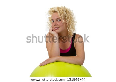 Beautiful young woman with gym ball -  isolated on white background