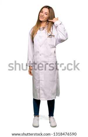 Full body Young doctor woman making phone gesture. Call me back sign on isolated background