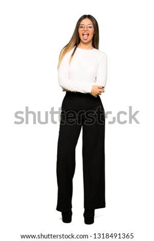 Full body of Pretty woman with glasses showing tongue at the camera having funny look