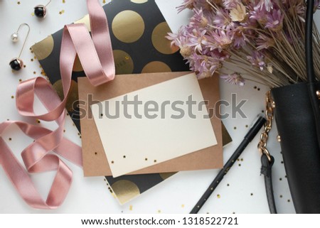 card mockup with bag, flowers, notebook and pen