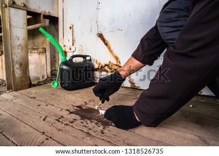 arson attack crime scene with gangster Royalty-Free Stock Photo #1318526735