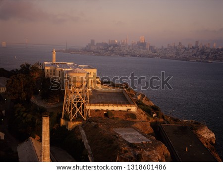 View of San Francisco from Alcatraz Island-High angle view of an industrial unit with a city in the background.