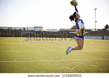 Cheerleader jumping high