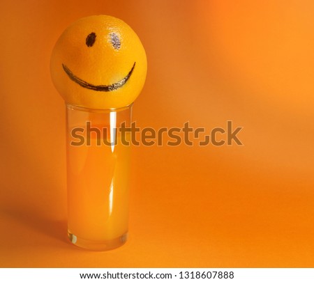 emotions are abstract. orange mood cheerful orange on a glass with orange juice design concept. optimism close -up  copy space