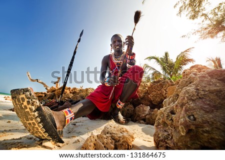 Maasai by the ocean on the beach. Kenya Royalty-Free Stock Photo #131864675