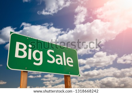 Big Sale Green Road Sign Aginst Sky.