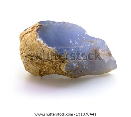 Single rough natural blue chalcedony rock isolated on white background Royalty-Free Stock Photo #131870441
