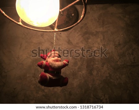 santa hanging on the lamp