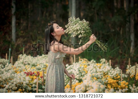 Asian woman in the flower garden