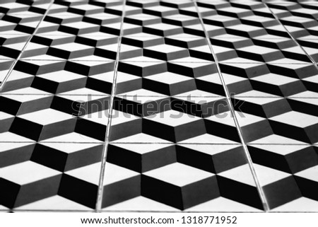 Perspective view of the floor of retro tiles. Repeating geometric patterns of dice on the floor of ceramic tile.