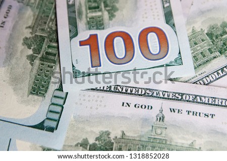 A pile of one hundred US banknotes with president portraits. Cash of hundred dollar bills, dollar background image with high resolution 