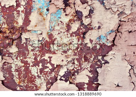 Rusty cracked pink-yellow paint surface with blue details close up, grunge horizontal shabby background