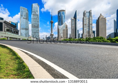 Asphalt road passes through Shanghai Lujiazui Financial District