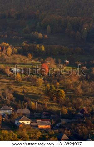 Beautiful landscape showing the beauty of autumn in a village in the countryside of Maramures county, Romania