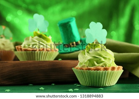 Cake with clover on color table. St. Patrick's Day celebration