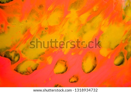 Abstract background formed by colored paint stains randomly spilled on the floor