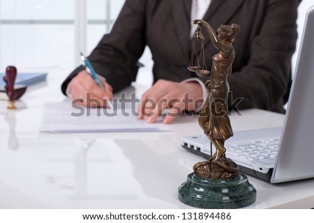 Notary public signing document at his workplace Royalty-Free Stock Photo #131894486