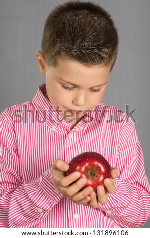 photograph of a child posing with apples varied