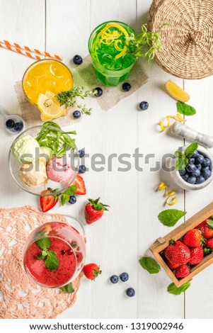 Frame of ice cream cocktails and berries