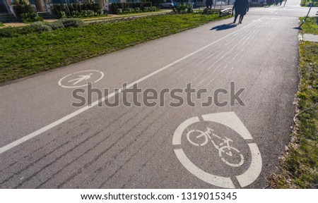 Bicycle road sign painted on the pavement. Bicycle lane,Bicycle sign on the road.
