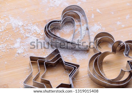 Pastry cutter on wooden board