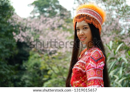 Beautiful young asian woman and hmong tribal dressing style of northern thailand