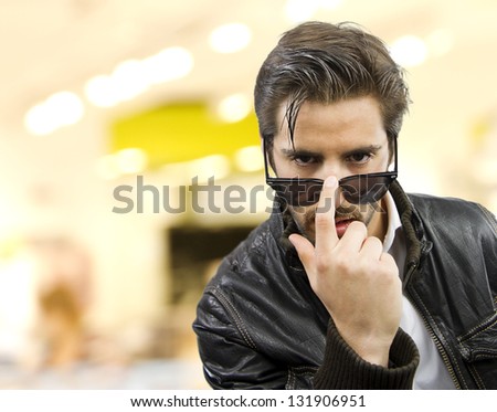 young handsome rocker  man shopping in a market