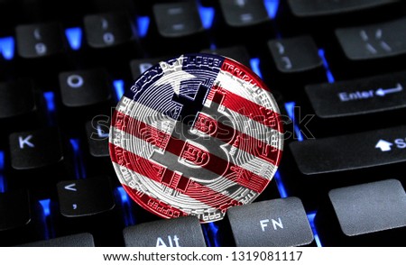 Bitcoin close-up on keyboard background, the flag of Liberia is shown on bitcoin.