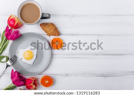 Mother's day composition.Breakfast with tulips on white background. Royalty-Free Stock Photo #1319116283