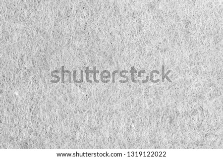 Black fiber line mat texture.
Abstract gray structure of synthetic fibers background. 
White grunge cotton fabric knit background. 
Selective focus.
top view.