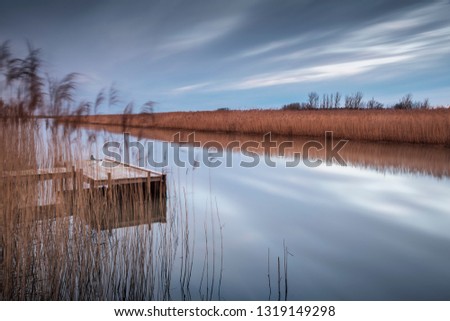 Wooden jetty by lake. Utvalinge, Sweden.