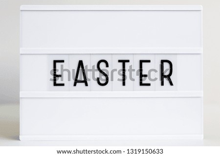 close up of vintage lightbox with word Easter on the table