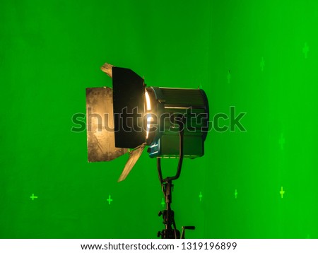 On a light background with smoke (chromakey). Professional light for the production of cinema, TV shows in the green room