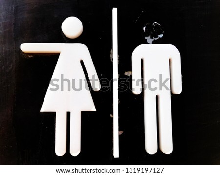 Signs showing the entrance to the damaged toilet - Image