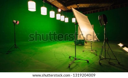 Modern TV Studio Green Screen chroma key background with camera and Light Equipment