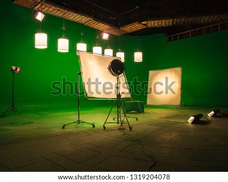 Modern TV Studio Green Screen chroma key background with camera and Light Equipment