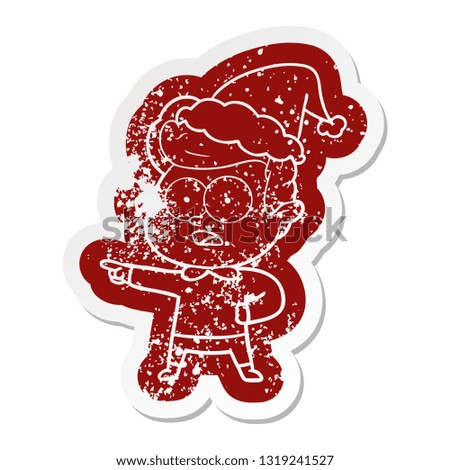 quirky cartoon distressed sticker of a staring man wearing santa hat