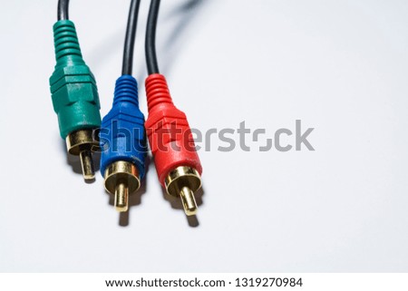 White background. Several black wires with plugs. TV cable, multimedia. Tulip. Different color. 