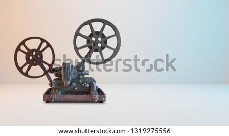 Old vintage cinema movie projector with white horizontal background .
