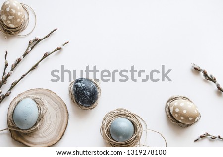 Pastel composition for the holiday of Easter. Colored eggs in natural colors. Background for the presentation of work or text. Top view. Copy space.  Mock-up