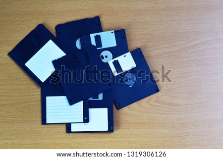 floppy disks on a wooden table